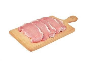 Raw meat steaks on wooden board, isolated on white background