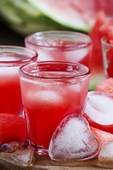 Watermelon cold drink with ice in a heart shape, selective focus