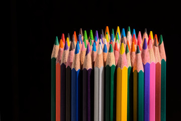 color pencils set on black background
