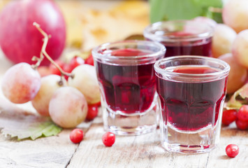 Homemade red wine glasses on the autumn background, selective fo