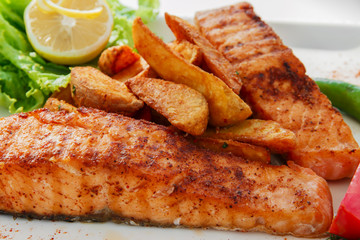 fried fish fillet of salmon with potatoes