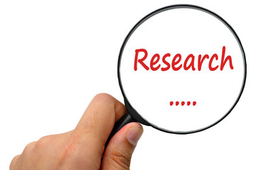 research word. Magnifier and puzzles.