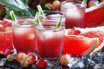 Grape-grapefruit cocktail with crushed ice, selective focus