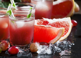 Grape-grapefruit cocktail with crushed ice, selective focus