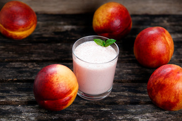 cocktail from greek yogurt and Fresh juicy Nectarine Fruit .close up. on old wooden table. background. selected focus