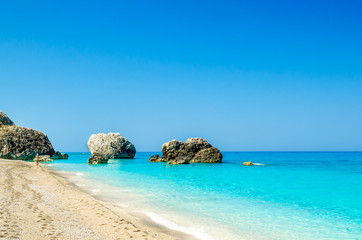 Megali Petra Beach, Lefkada Island, Levkas, Lefkas, Ionian sea, Greece. Wild beach of Megali Petra. A beautiful beach with large rocks in the water.