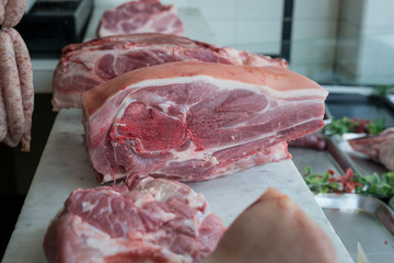 Joints of raw meat on a butchers display