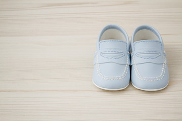 Pair of  Classic Blue Baby Shoes on Grey background with Copy Space