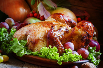 Festive baked chicken with autumn berries, fruits, nuts and vege