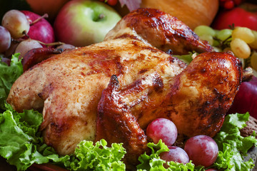 Festive baked chicken with autumn berries, fruits, nuts and vege
