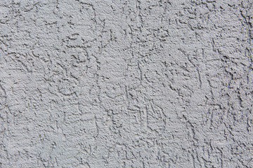 wall element with a relief plaster, painted with colored inks