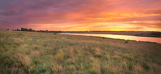 hills covered with steppe herbs on the river bank