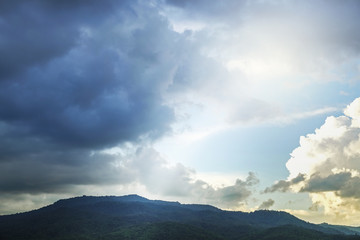 storm and rain cloud moving past the mountain