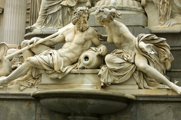 Naklejka premium mythology fountain on the front of Vienna parliament