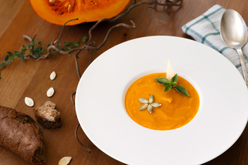 pumpkin cream soup with basil leaf