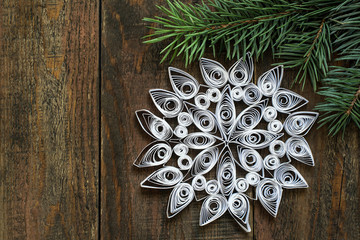 Goodly snowflake in quilling techniques for Christmas decoration