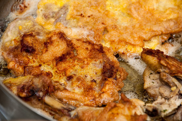 Pork meat frying in the frying pan