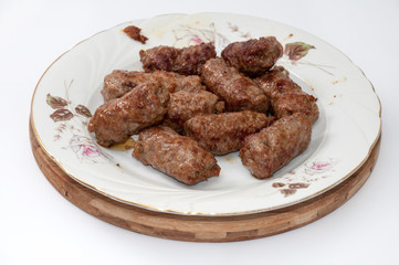 Balkan kebabs with minced meat served in the plate