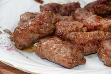 Balkan kebabs with minced meat served in the plate