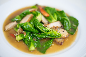 Fried kale with crispy pork