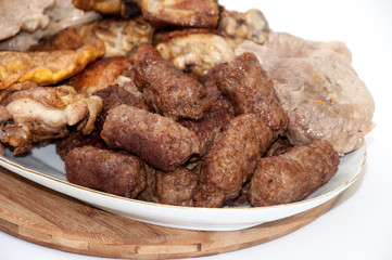 Kebabs chicken drumsticks and pork steaks