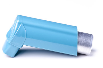 Blue asthma drug inhaler on white background studio shot