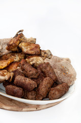 Kebabs chicken drumsticks and pork steaks