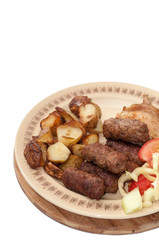 Young potaotes kebabs fried pork tomato salad paprika