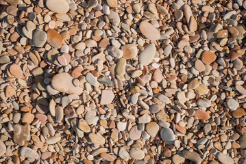 Pebble beach texture. Sea stones background.