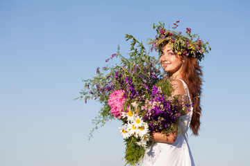 Portrait of Young beautiful Woman with Bouquet, wearing a Wreath