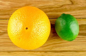Orange and lime on rustic background