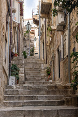 Narrow and empty alley and stairs at the Old Town in Dubrovnik, Croatia.