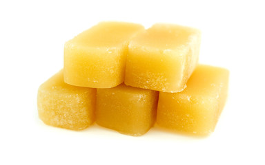 Cubes of all natural beeswax isolated on white