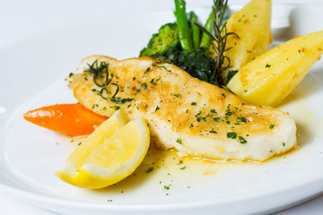 snow fish with a butter, lemon and rosemary