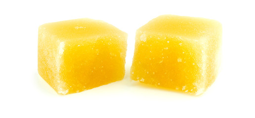 Extreme macro of natural beeswax isolated against a white backgr