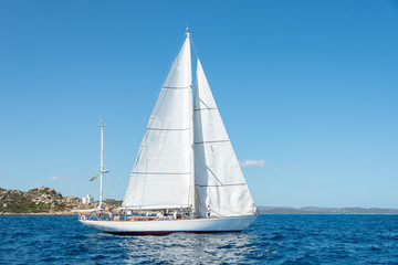 Elegant old italian style sailboat, on a wonderful blue sea, Sardinia, Italy