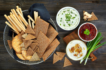 various dip sauces and bowl of bread cookies