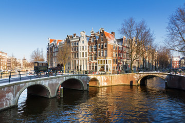 Beautiful early morning winter view on one of the Unesco world heritage city canals of Amsterdam,...