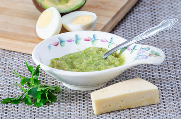 Avocado paste with egg and cheese