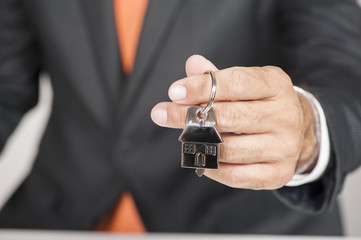 Hand with a house key