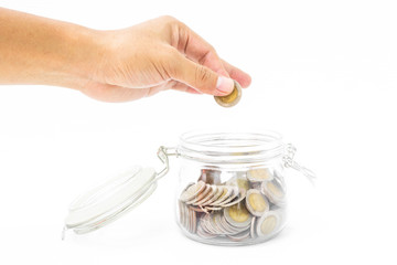 Man hand fill coin into piggy bank saving