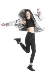 jumping woman dressed in a jacket - parka, isolated on white