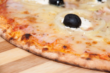 Pizza with onions ham black olives ketchup