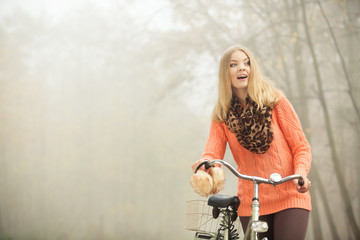 Fototapeta na wymiar Happy woman with bike bicycle in autumn park.