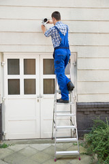 Technician Installing Cctv Camera