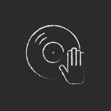 Dj hand with disc icon drawn in chalk.