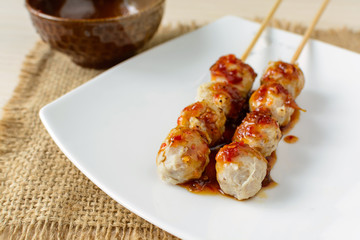 Grilled meat ball with spicy sauce