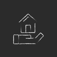 House insurance icon drawn in chalk.