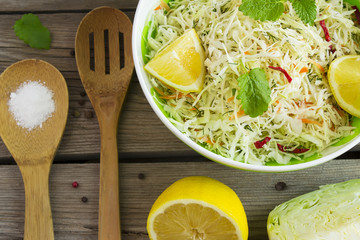 Vitamin cabbage salad with carrots and lemon juice, top view
