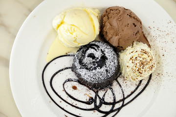 Chocolate lava cake with ice-cream in the dish